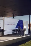 Man charging a Renault Trucks E-Tech D
