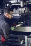 Man repairing trucks